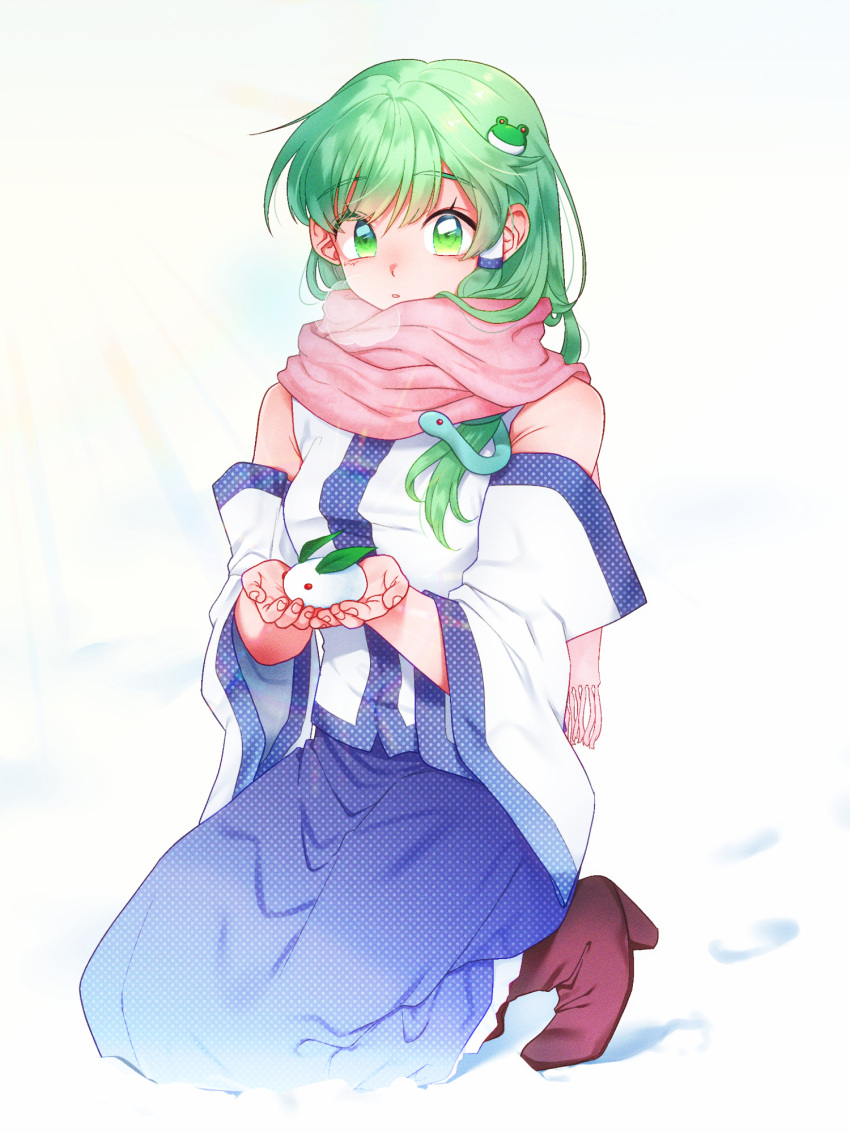 1girl :o arms_up bangs blue_skirt boots commentary_request detached_sleeves eyebrows_visible_through_hair fingernails footprints frog_hair_ornament green_eyes green_hair hair_ornament hair_tubes highres holding kneeling kochiya_sanae long_hair looking_at_viewer mito_(mo96g) nontraditional_miko pink_scarf polka_dot_skirt purple_footwear scarf simple_background skirt snake_hair_ornament snow snow_bunny solo touhou unmoving_pattern very_long_hair white_background