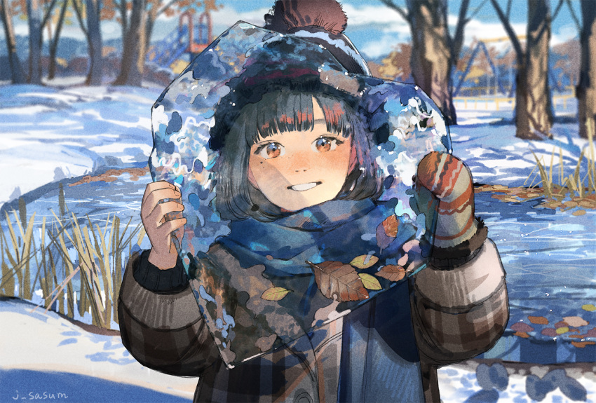 1girl bangs beanie black_hair black_headwear blue_scarf blush brown_eyes coat day grin hat heart holding ice leaf long_sleeves looking_at_viewer mole mole_under_eye original outdoors pom_pom_(clothes) pond sasumata_jirou scarf short_hair single_mitten slide smile snow solo swing tree twitter_username water winter winter_clothes