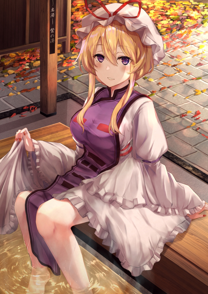 1girl ashiyu autumn_leaves blonde_hair blush breasts commentary_request fingernails hair_between_eyes hat hat_ribbon highres juliet_sleeves large_breasts leaf light_smile long_sleeves looking_at_viewer maple_leaf mob_cap parted_lips puffy_sleeves red_nails red_ribbon ribbon sharp_fingernails short_hair sidelocks sitting soaking_feet solo symbol_commentary tabard torottye touhou violet_eyes water white_headwear wide_sleeves yakumo_yukari