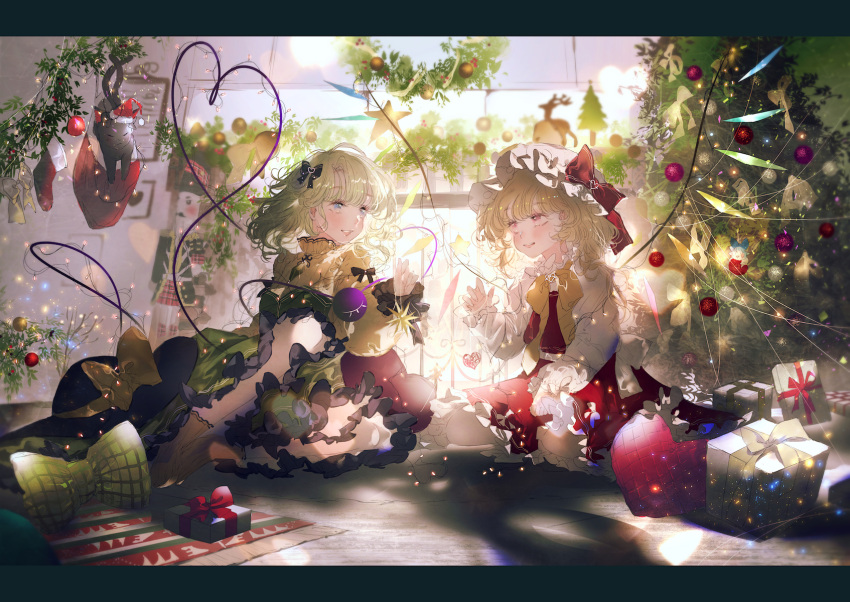 2girls backlighting black_headwear blonde_hair blouse blush bow christmas_tree commentary_request eyeball flandre_scarlet frills green_eyes green_hair green_skirt grin hat hat_bow hat_removed headwear_removed heart heart_of_string highres komeiji_koishi looking_at_another majamari mob_cap multiple_girls parted_lips pink_eyes red_bow red_skirt red_vest short_hair sitting skirt skirt_set smile star_(symbol) third_eye touhou vest wariza wavy_hair white_headwear wide_sleeves yellow_blouse yellow_bow yellow_neckwear