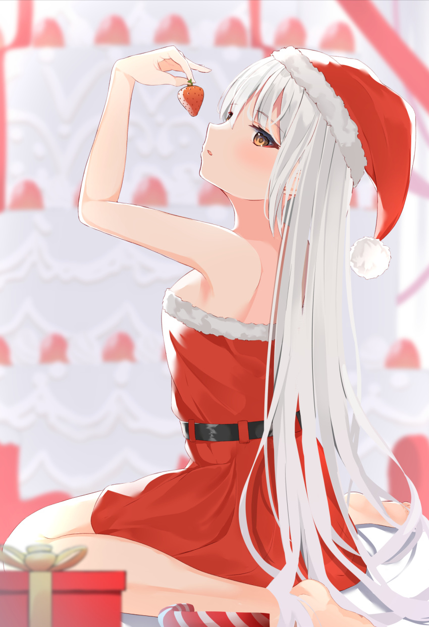 1girl arm_up bangs barefoot blurry blurry_background blurry_foreground blush box breasts brown_eyes candy candy_cane christmas commentary_request depth_of_field dress eyebrows_visible_through_hair food fruit fur-trimmed_dress fur-trimmed_headwear fur_trim gift gift_box hair_between_eyes hat highres hikashou holding holding_food long_hair off-shoulder_dress off_shoulder original parted_lips red_dress red_headwear santa_costume santa_hat sitting small_breasts solo strawberry very_long_hair wariza white_hair