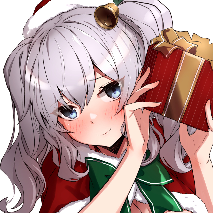 1girl bell blue_eyes blush box breasts capelet christmas closed_mouth eyebrows_visible_through_hair gift gift_box hair_between_eyes hat highres holding holding_gift kantai_collection kashima_(kantai_collection) large_breasts long_hair portrait red_capelet santa_costume santa_hat silver_hair simple_background solo takanashi_kei_(hitsujikan) twintails white_background