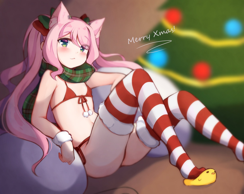 1girl animal_ear_fluff animal_ears bikini blush cat_ears christmas christmas_tree commentary elbow_rest english_commentary extra_ears flat_chest foot_out_of_frame front-tie_bikini front-tie_top fur-trimmed_legwear fur_trim green_eyes green_scarf highres knees_up long_hair looking_at_viewer merry_christmas navel nyatrix original pink_hair plaid plaid_scarf pom_pom_(clothes) red_bikini sack scarf side-tie_bikini slippers solo striped striped_legwear swimsuit thigh-highs