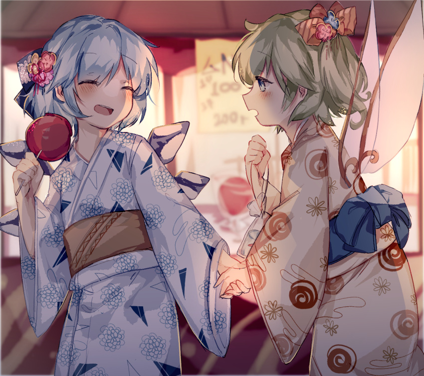 2girls alternate_costume bag bagged_fish blue_bow blue_eyes blue_hair blue_kimono blush booth bow candy_apple cirno closed_eyes commentary cowboy_shot daiyousei detached_wings fairy_wings fish food green_hair hair_bow hair_ornament hand_up holding holding_food holding_hands ice ice_wings japanese_clothes kimono long_sleeves looking_at_another multiple_girls night open_mouth print_kimono short_hair side_ponytail sorani_(kaeru0768) summer_festival touhou wide_sleeves wings yukata