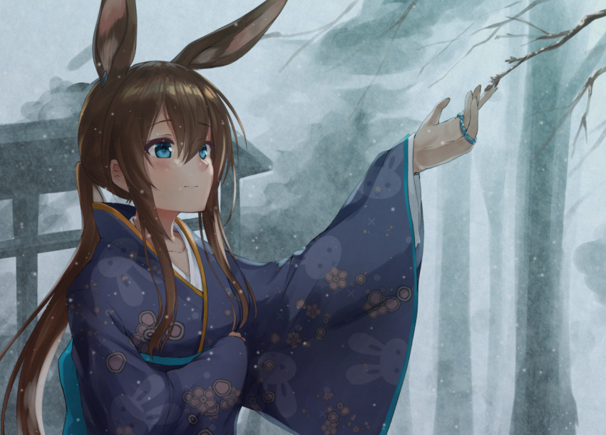1girl akabane_hibame alternate_costume amiya_(arknights) animal_ears animal_print arknights arm_up bangs bare_tree blue_kimono blush brown_eyes brown_hair bunny_girl bunny_print closed_mouth commentary_request day extra_ears eyebrows_visible_through_hair floral_print hair_between_eyes japanese_clothes jewelry kimono long_hair long_sleeves outdoors outstretched_arm ponytail print_kimono rabbit_ears ring sidelocks smile snowing solo tree tree_branch wide_sleeves winter