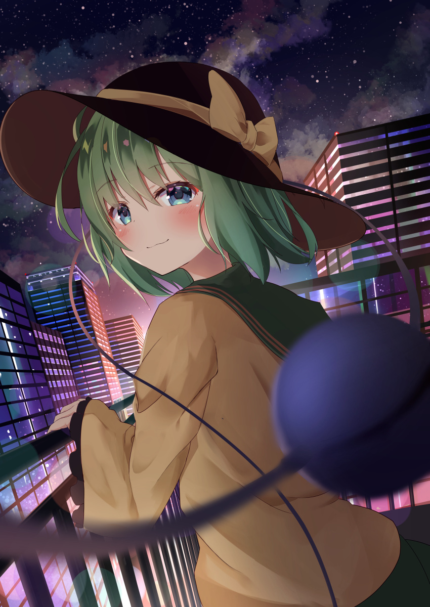 1girl absurdres bangs black_headwear blouse blue_eyes blurry blurry_foreground blush bokeh bow building cityscape closed_mouth clouds cloudy_sky commentary_request depth_of_field dutch_angle eyeball eyebrows_visible_through_hair frills green_hair green_skirt hair_between_eyes hat hat_bow highres kirikaze_ren komeiji_koishi looking_at_viewer looking_back night night_sky railing short_hair skirt sky smile solo standing star_(sky) starry_sky third_eye touhou upper_body wide_sleeves yellow_blouse yellow_bow