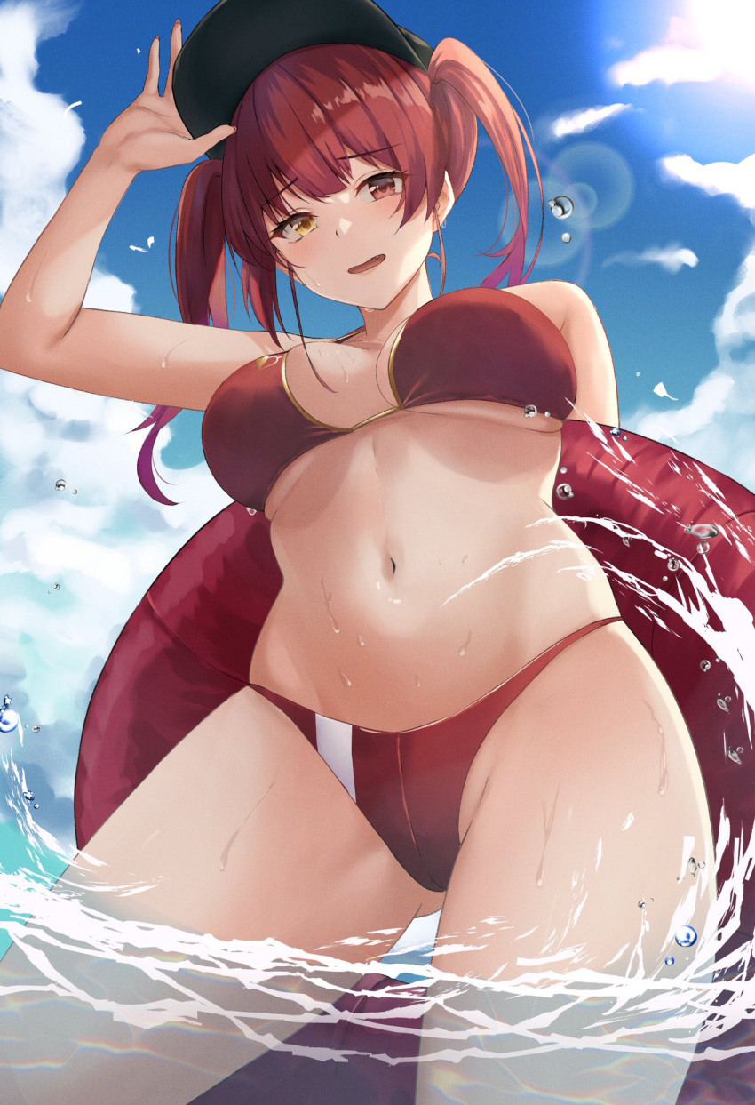 1girl adjusting_clothes adjusting_headwear ass_visible_through_thighs bangs bare_shoulders bikini black_headwear blue_sky breasts clouds commentary_request day eyebrows_visible_through_hair fang from_below hat heterochromia highres hololive houshou_marine in_water innertube large_breasts long_hair looking_at_viewer navel open_mouth outdoors red_bikini red_eyes redhead sky smile solo stomach sunlight swimsuit thighs twintails virtual_youtuber water_drop yamikyon yellow_eyes