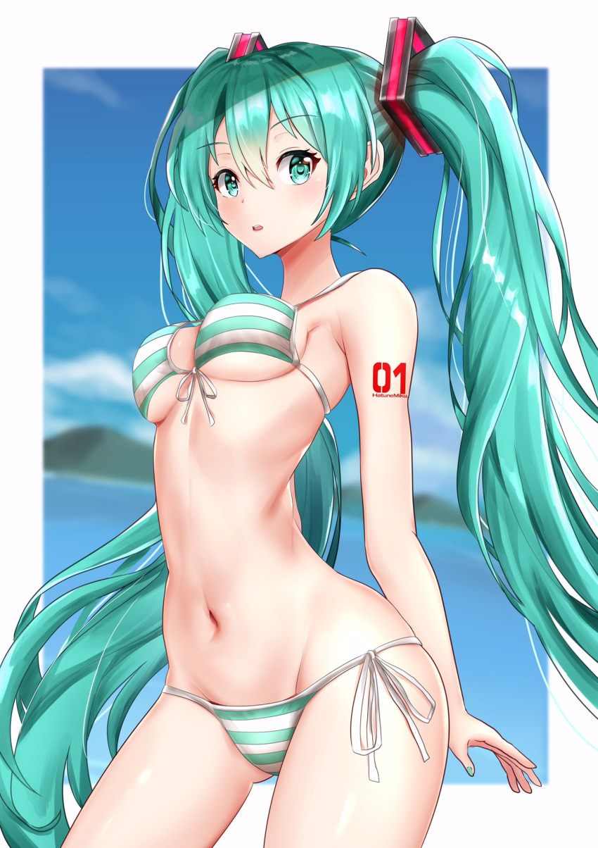 1girl aqua_eyes aqua_hair aqua_nails arms_behind_back bikini blue_sky breasts commentary contrapposto cowboy_shot framed_image hair_ornament hatsune_miku highres itogari long_hair looking_at_viewer medium_breasts mountainous_horizon nail_polish navel ocean shoulder_tattoo sky strap_gap striped striped_bikini swimsuit tattoo twintails under_boob very_long_hair vocaloid