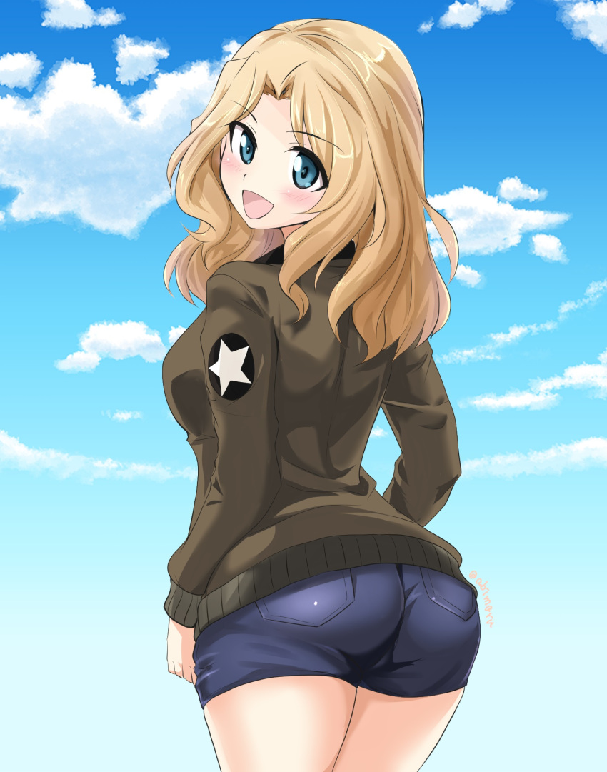 1girl :d abimaru_gup ass blonde_hair blue_eyes blue_shorts blue_sky brown_jacket clouds cloudy_sky commentary day denim denim_shorts emblem eyebrows_visible_through_hair from_behind girls_und_panzer hair_intakes highres jacket kay_(girls_und_panzer) long_hair long_sleeves looking_at_viewer looking_back military military_uniform open_mouth outdoors saunders_military_uniform short_shorts shorts sky smile solo standing star_(symbol) twitter_username uniform