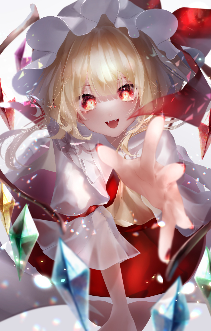 +_+ 1girl :d absurdres ascot bangs blonde_hair blurry blurry_foreground bow commentary_request crystal depth_of_field eyebrows_visible_through_hair fangs flandre_scarlet foreshortening frills hat hat_bow highres looking_at_viewer mob_cap open_hand open_mouth puffy_short_sleeves puffy_sleeves reaching_out red_bow red_eyes red_shirt red_skirt shirt short_hair short_sleeves simple_background skirt skirt_set smile solo touhou white_background white_headwear wings yellow_neckwear yukia_(yukia_777)