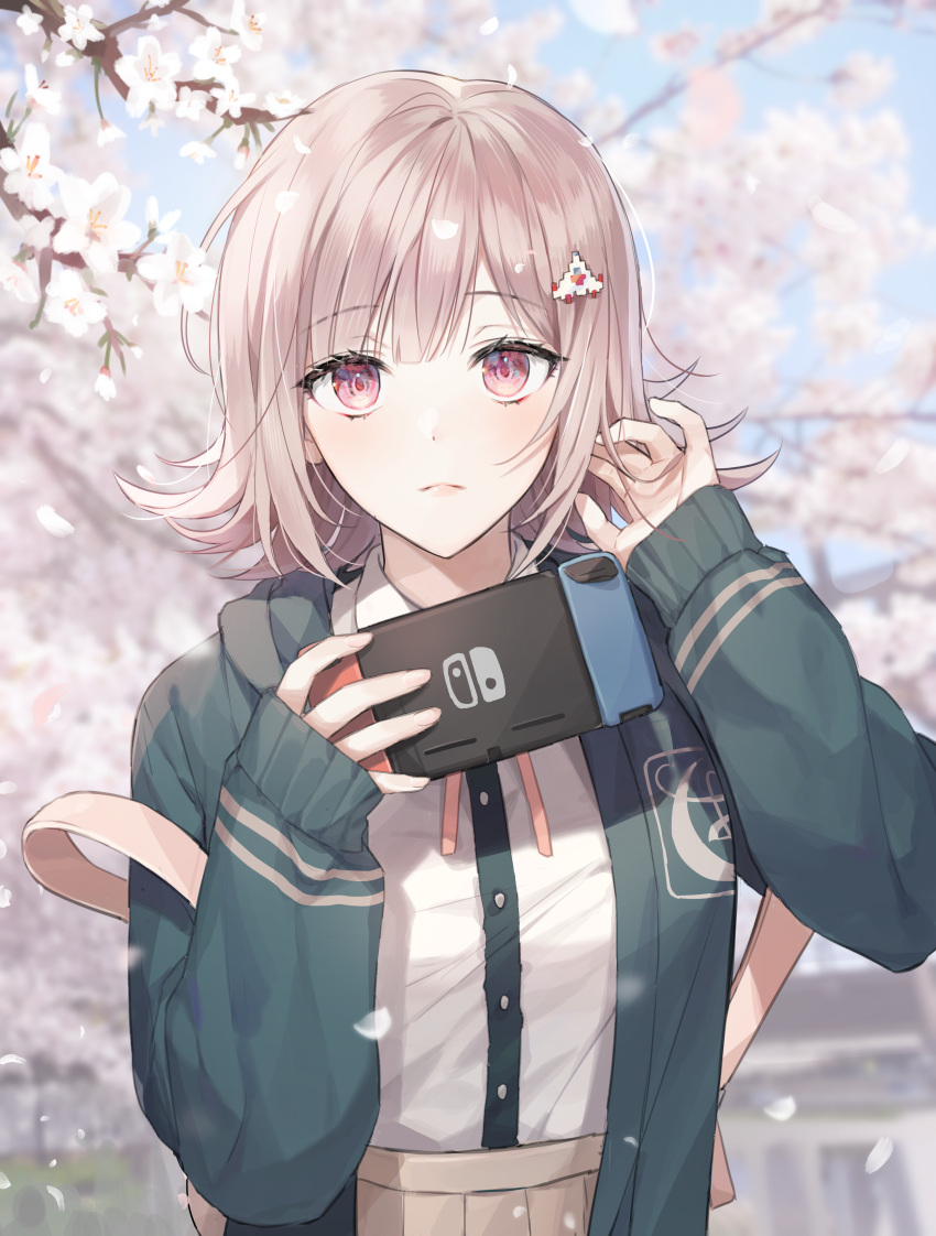 1girl absurdres bag bangs brown_skirt cherry_blossoms closed_mouth commentary_request dangan_ronpa_(series) dangan_ronpa_2:_goodbye_despair day doomie1 dress_shirt eyebrows_visible_through_hair flipped_hair frown green_jacket hair_ornament hairclip hand_in_hair handheld_game_console hands_up highres holding holding_handheld_game_console hood hooded_jacket jacket light_brown_hair looking_at_viewer nanami_chiaki neck_ribbon nintendo_switch open_clothes open_jacket outdoors petals pink_eyes pink_ribbon pleated_skirt ribbon shiny shiny_hair shirt shirt_tucked_in skirt sleeves_past_wrists solo spaceship_hair_ornament upper_body white_shirt
