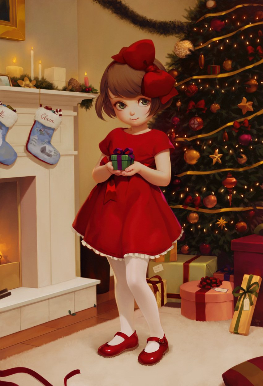 1girl alkemanubis bangs bow box brown_hair candle child christmas_lights christmas_ornaments christmas_stocking christmas_tree dress fire flame gift gift_box green_eyes hair_bow highres holding_gift indoors looking_at_viewer original pantyhose red_bow red_dress short_hair smile solo standing white_legwear white_pantyhose