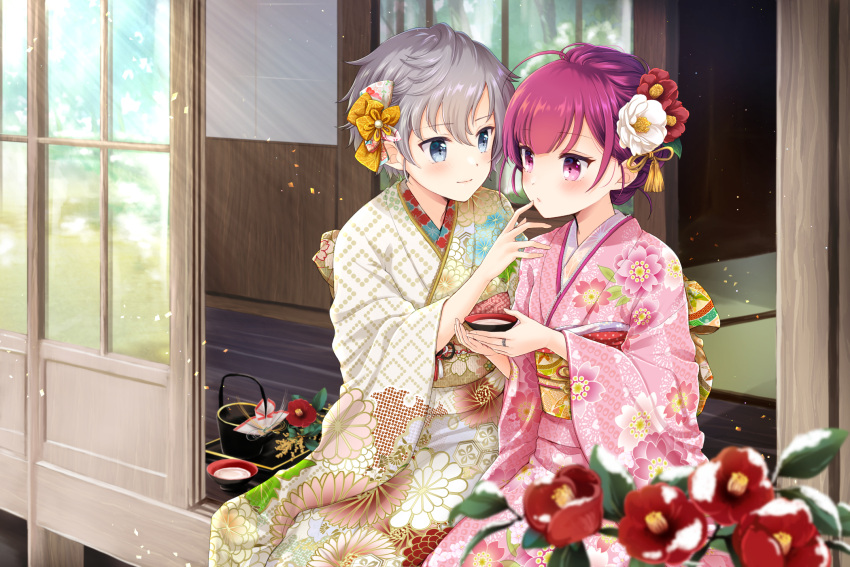 2girls bangs blue_eyes blurry_foreground chiwa_(chiwawanwan1206) closed_mouth cup eyebrows_visible_through_hair floral_print flower hair_between_eyes hair_flower hair_ornament highres holding japanese_clothes kimono magia_record:_mahou_shoujo_madoka_magica_gaiden mahou_shoujo_madoka_magica multiple_girls obi outdoors pink_kimono print_kimono red_eyes red_flower sakazuki sash shinobu_akira_(magia_record) sitting smile snow sunlight tokiwa_nanaka white_flower yukata yuri