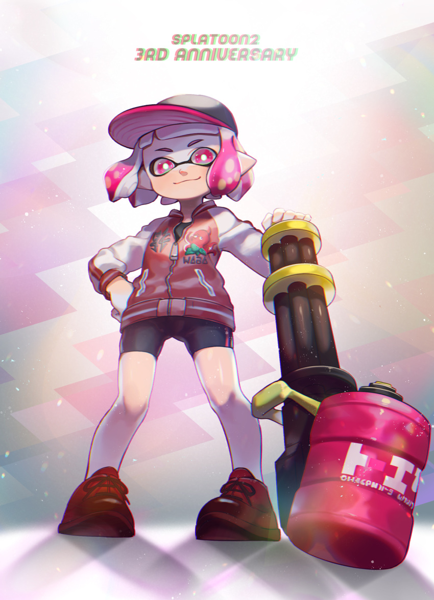 1girl bangs baseball_cap bike_shorts black_headwear black_shorts blunt_bangs bob_cut bright_pupils closed_mouth commentary copyright_name domino_mask english_text full_body hand_on_hip hat heavy_splatling_(splatoon) highres holding holding_weapon inkling inkling_(language) jacket letterman_jacket long_sleeves looking_at_viewer mask pink_eyes pink_hair pointy_ears red_footwear red_jacket shoes short_hair shorts single_vertical_stripe smile sneakers solo splatoon_(series) splatoon_2 standing tentacle_hair weapon white_pupils yamagishi_chihiro