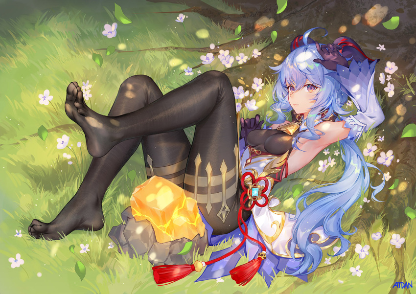 1girl ahoge arm_up armpits atdan bare_shoulders bell black_legwear black_leotard blue_hair breasts cowbell day detached_collar detached_sleeves feet fine_fabric_emphasis flower ganyu_(genshin_impact) gem genshin_impact goat_horns gold_trim horns knees_up leaf leg_up leotard long_hair long_sleeves looking_at_viewer low_ponytail lying medium_breasts no_shoes on_back outdoors pantyhose rock rope solo sunlight tassel tree tree_shade violet_eyes waist_cape white_flower