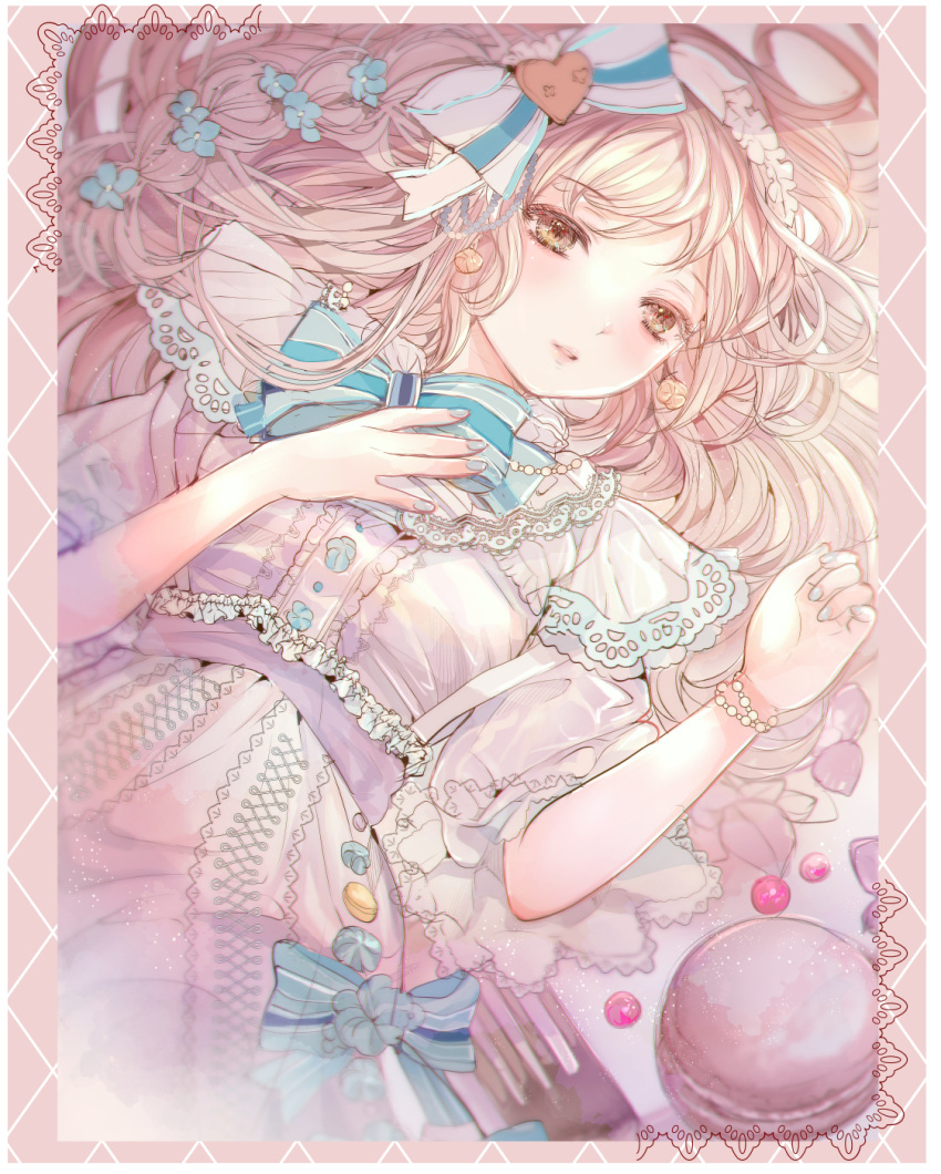 1girl blonde_hair blue_ribbon bracelet brown_eyes eyebrows_visible_through_hair flower food fork hair_flower hair_ornament hair_ribbon hair_spread_out highres jewelry komirihikku long_hair lying macaron original oversized_food oversized_object parted_lips ribbon solo utensil