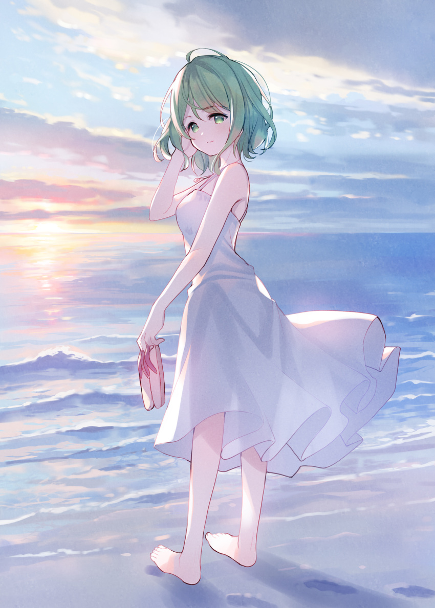 1girl bangs bare_arms bare_shoulders barefoot beach blue_sky breasts brown_footwear closed_mouth clouds cloudy_sky dress eyebrows_visible_through_hair footprints from_behind green_eyes green_hair hair_between_eyes hand_up highres holding holding_clothes holding_footwear horizon looking_at_viewer looking_back meito_(maze) morinaka_kazaki nijisanji ocean outdoors sand sandals sandals_removed sky sleeveless sleeveless_dress small_breasts smile solo standing sun_(symbol) sunset virtual_youtuber water waves white_dress