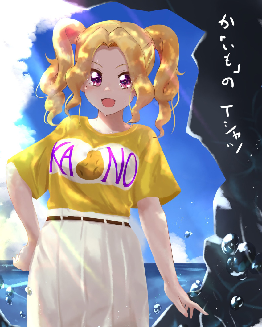 1girl :d aikatsu! aikatsu!_(series) beach belt blush breasts brown_belt clouds cloudy_sky collarbone commentary_request cowboy_shot daichi_nono day drill_hair eyebrows_visible_through_hair eyes_visible_through_hair food_print hair_intakes hand_on_hip high-waist_skirt highres large_breasts light_rays long_skirt looking_at_viewer mole mole_under_eye multicolored_shirt ocean open_mouth pleated_skirt potato potato_print rock romaji_text shirt shirt_tucked_in short_sleeves skirt sky smile solo standing sunlight t-shirt taiyaki29 tented_shirt translation_request twin_drills twintails violet_eyes water_drop wet white_shirt white_skirt yellow_shirt