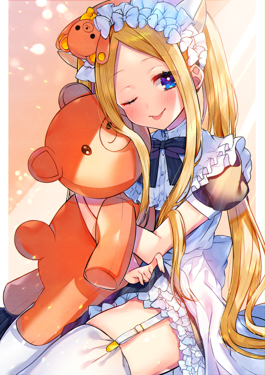 1girl abigail_williams_(fate) akirannu animal_ears apron backlighting bangs blonde_hair blue_dress blue_eyes blush bow breasts cat_ears check_commentary commentary commentary_request cook_heart_(fate) dress fate/grand_order fate_(series) forehead hair_bow highres light_particles light_rays long_hair looking_at_viewer multiple_bows multiple_hair_bows one_eye_closed parted_bangs puffy_short_sleeves puffy_sleeves short_sleeves sidelocks small_breasts smile stuffed_animal stuffed_toy teddy_bear thigh-highs thighs tongue tongue_out twintails white_legwear
