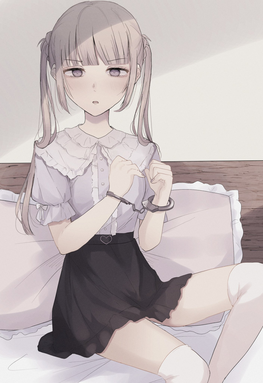 1girl bangs black_skirt blush brown_hair center_frills commentary_request cuffs eyebrows_visible_through_hair feet_out_of_frame frilled_pillow frills grey_eyes grey_nails grey_shirt handcuffs hands_up highres long_hair looking_at_viewer nail_polish original over-kneehighs pillow puffy_short_sleeves puffy_sleeves restrained shirt short_sleeves sidelocks sitting skirt solo thigh-highs tsuruse twintails v-shaped_eyebrows very_long_hair white_legwear