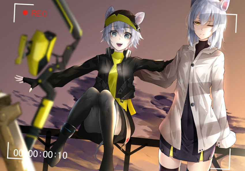 2girls animal_ears ankle_cuffs arknights black_legwear blue_eyes breasts click_(arknights) commentary_request covered_navel grey_hair jacket kureneko looking_at_viewer mole mole_under_mouth mouse_ears mouse_girl mouse_tail multiple_girls one_eye_closed open_mouth outdoors scavenger_(arknights) shirt short_hair small_breasts smile sunset tail white_jacket yellow_eyes yellow_shirt