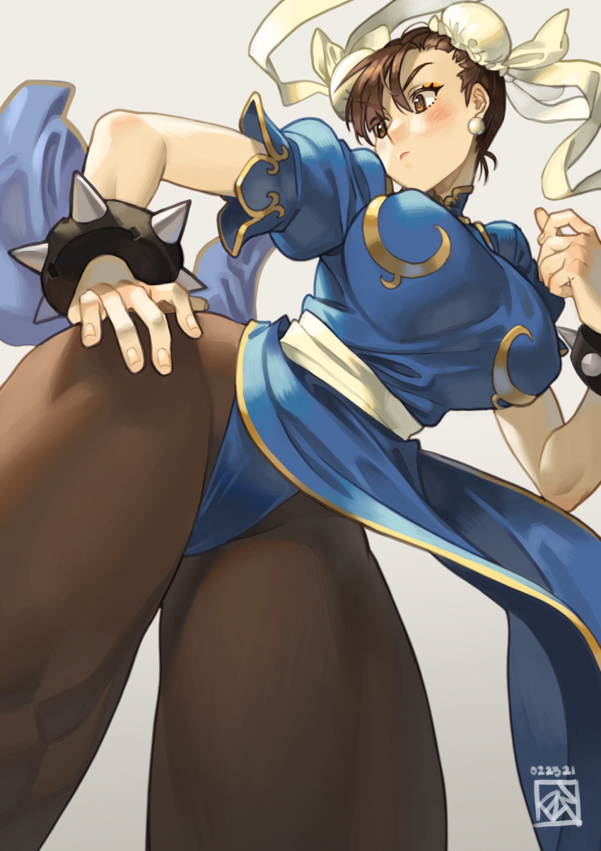 1girl blue_dress blue_panties blush bracelet breasts brown_eyes brown_hair brown_legwear bun_cover china_dress chinese_clothes chun-li covered_nipples double_bun dress earrings english_commentary fingernails from_below grey_background highres jewelry large_breasts panties panties_over_pantyhose pantyhose pantyshot pelvic_curtain poch4n puffy_short_sleeves puffy_sleeves ribbon sash short_hair short_sleeves slender_waist solo spiked_bracelet spikes street_fighter street_fighter_ii_(series) taut_clothes taut_dress thick_thighs thighs underwear white_ribbon