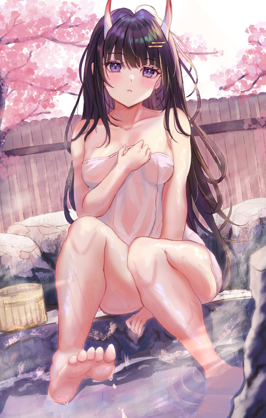 1girl azur_lane bare_shoulders breasts brown_hair bucket cherry_blossoms eyebrows_visible_through_hair full_body highres horns long_hair looking_at_viewer medium_breasts naked_towel noshiro_(azur_lane) oni_horns onsen panipo sitting solo stone towel violet_eyes white_towel