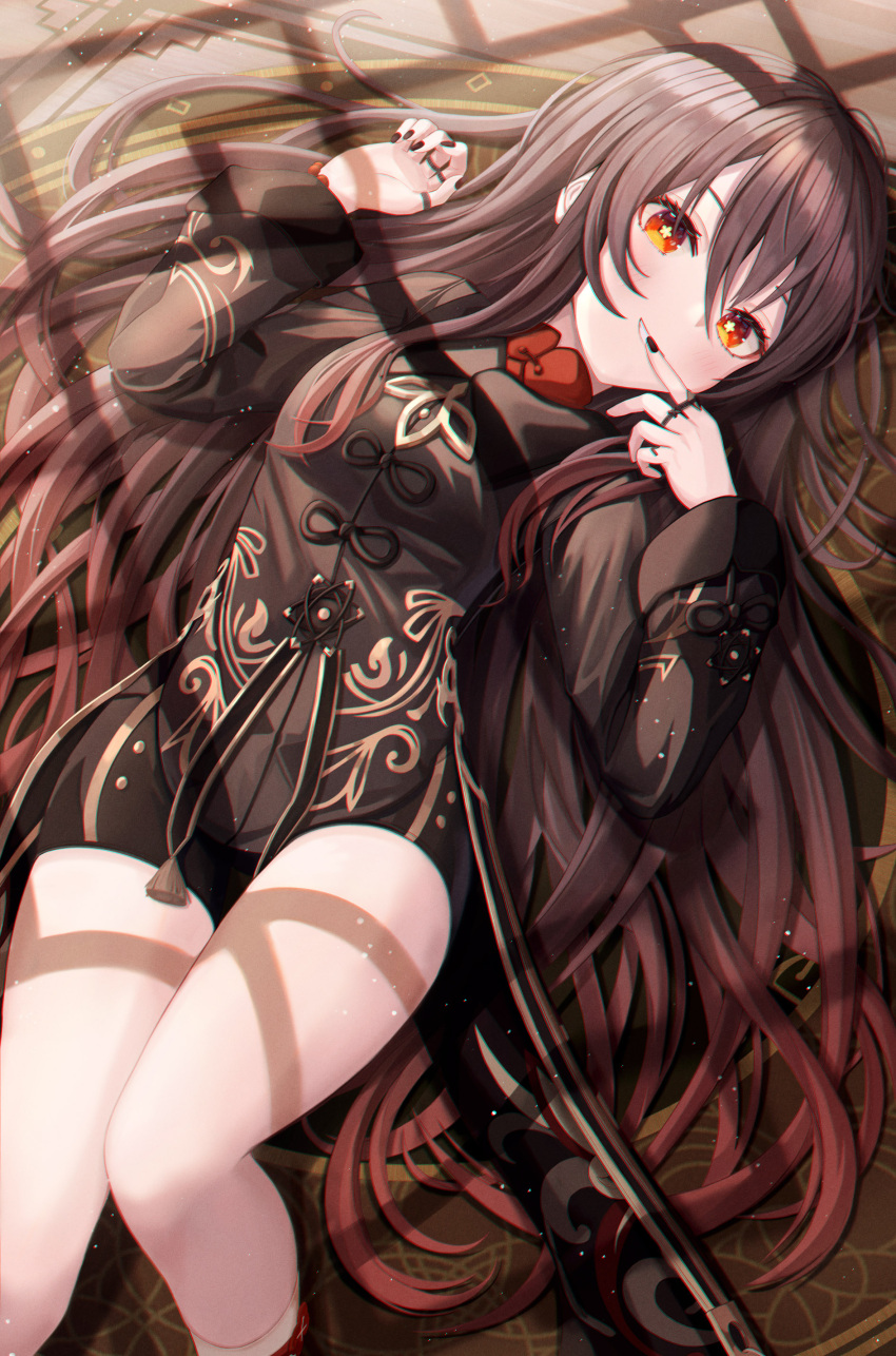 1girl :d absurdres bangs black_dress black_nails blush breasts brown_hair carpet chinese_clothes chromatic_aberration commentary dress eyebrows_visible_through_hair feet_out_of_frame finger_to_mouth flower-shaped_pupils funii genshin_impact grin hair_between_eyes highres hu_tao indoors jewelry long_hair long_sleeves looking_at_viewer lying nail_polish on_back on_floor open_mouth red_eyes revision ring small_breasts smile socks solo tassel thighs very_long_hair white_legwear window_shade