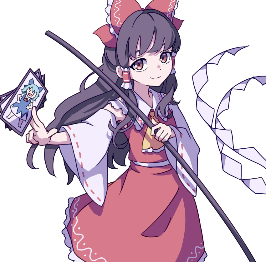 1girl absurdres ascot bangs between_fingers bow brown_hair card cirno closed_mouth detached_sleeves eyebrows_behind_hair frilled_hair_tubes gohei hair_bow hakurei_reimu highres holding holding_card kame_(kamepan44231) long_hair looking_at_viewer nontraditional_miko red_bow red_ribbon red_shirt red_skirt ribbon ribbon-trimmed_sleeves ribbon_trim shirt simple_background skirt smile solo standing touhou unconnected_marketeers white_background wide_sleeves yellow_neckwear