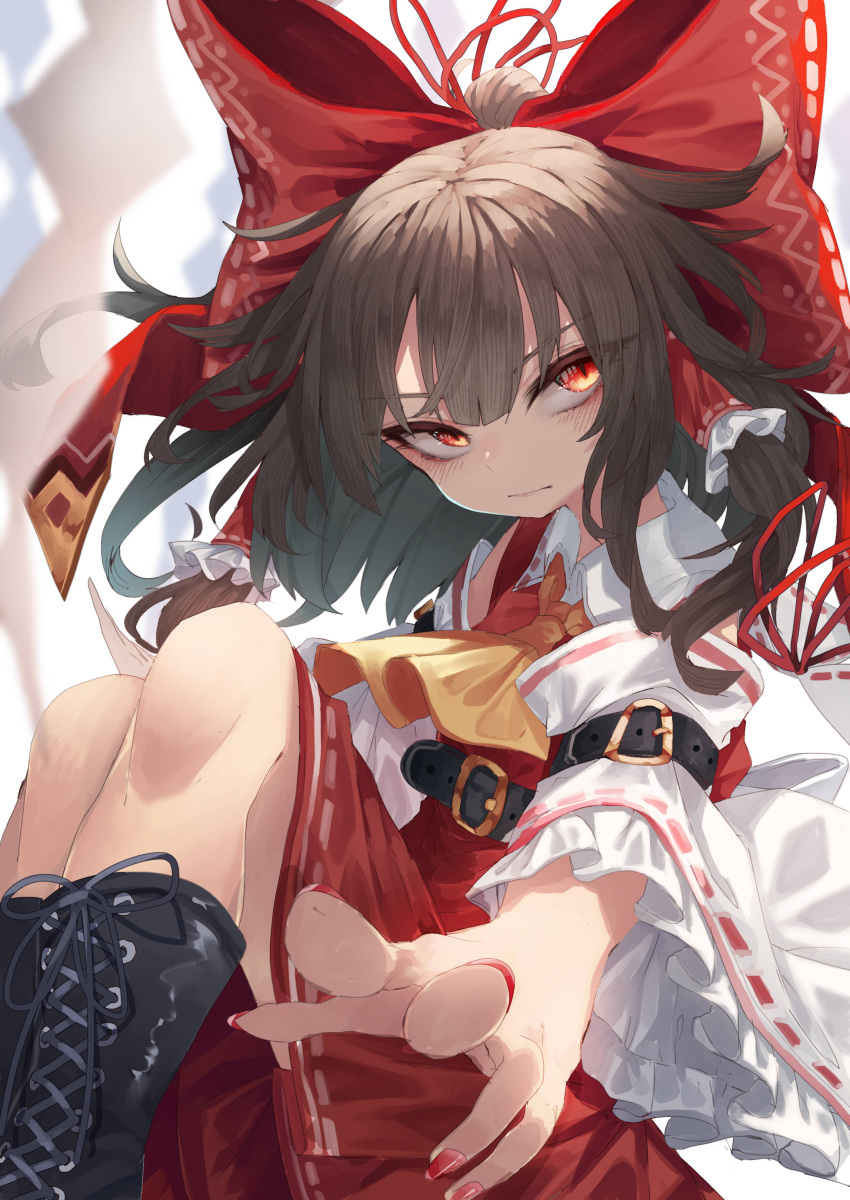 1girl absurdres arm_belt ascot bangs belt blurry blurry_background boots bow brown_hair closed_mouth detached_sleeves eyebrows_visible_through_hair eyes_visible_through_hair feet_out_of_frame floating_hair foreshortening frilled_hair_tubes hair_bow hair_tubes hakurei_reimu highres knees_up light_blush long_hair looking_to_the_side murayo red_bow red_eyes red_nails red_ribbon red_skirt red_vest ribbon ribbon-trimmed_sleeves ribbon_trim sidelocks simple_background skirt skirt_set slit solo touhou vest yellow_neckwear