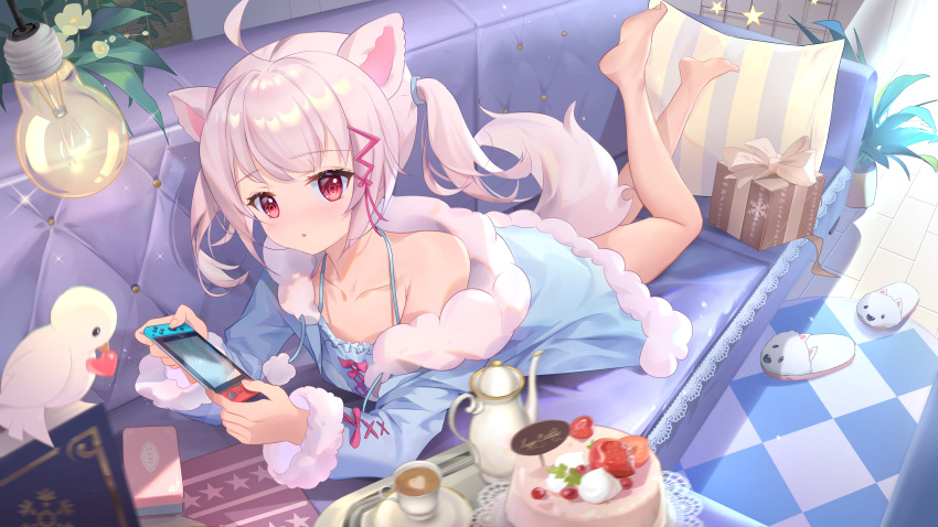 1girl :o absurdres animal_ears animal_slippers bangs bare_legs barefoot bird blue_pajamas box cake commentary_request couch cup cushion eyebrows_visible_through_hair feet_up food fox_ears fox_girl fox_tail fur_trim gift gift_box hair_ornament hair_tie highres holding lamp legs_up long_sleeves looking_at_viewer lying nintendo_switch on_couch on_stomach original pajamas pink_hair pink_tail plant potted_plant red_eyes shoes_removed short_twintails sidelocks slippers solo somna tail tea_set teacup teapot the_pose twintails virtual_youtuber