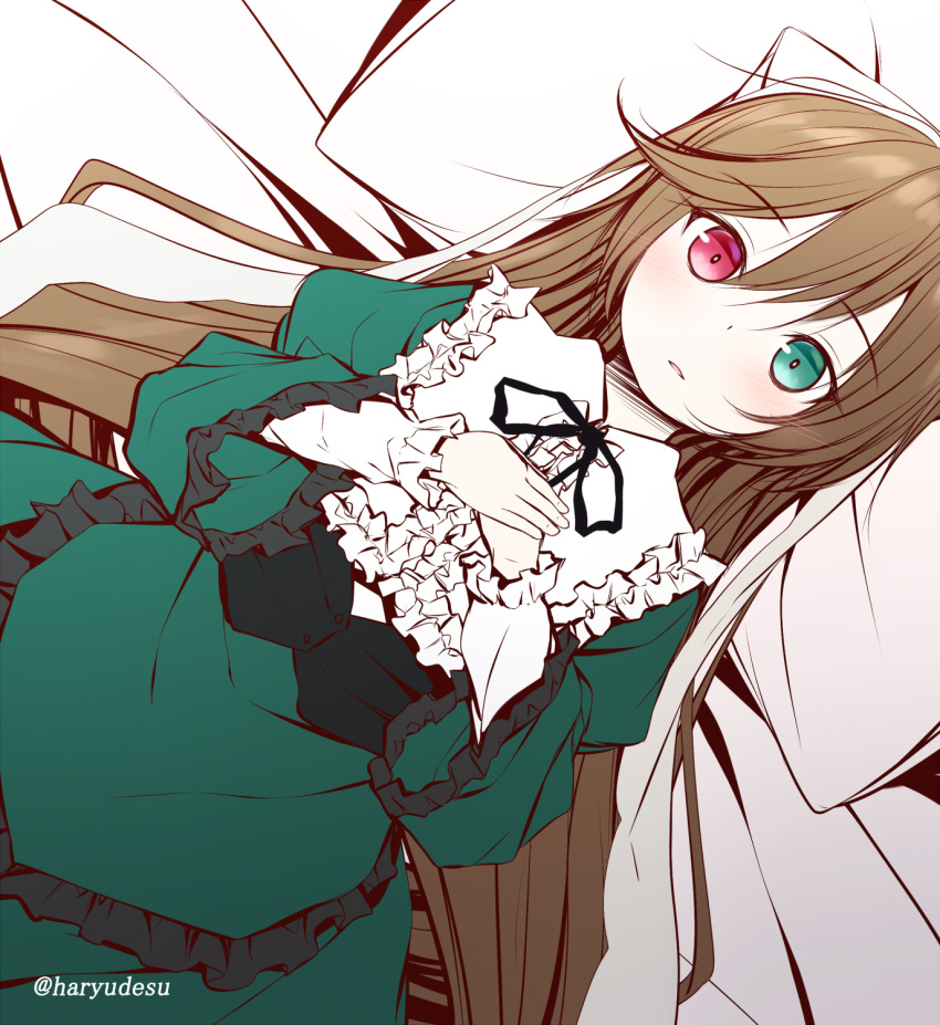 1girl bangs bed_sheet blush brown_hair commentary_request dress eyebrows_visible_through_hair frilled_dress frills green_dress green_eyes hair_between_eyes haryuu_(poetto) heterochromia highres juliet_sleeves long_hair long_sleeves lying on_back parted_lips pillow puffy_sleeves red_eyes rozen_maiden solo suiseiseki twitter_username very_long_hair wide_sleeves