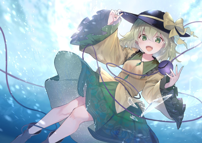 1girl bangs black_footwear black_headwear blue_background boots bow breasts commentary feet_out_of_frame frilled_sleeves frills green_eyes green_hair green_nails green_skirt hands_up hat hat_bow highres komeiji_koishi light_blush long_sleeves looking_at_viewer medium_hair open_mouth shirt skirt small_breasts smile solo symbol_commentary third_eye touhou wide_sleeves yellow_bow yellow_shirt yuki_(popopo)
