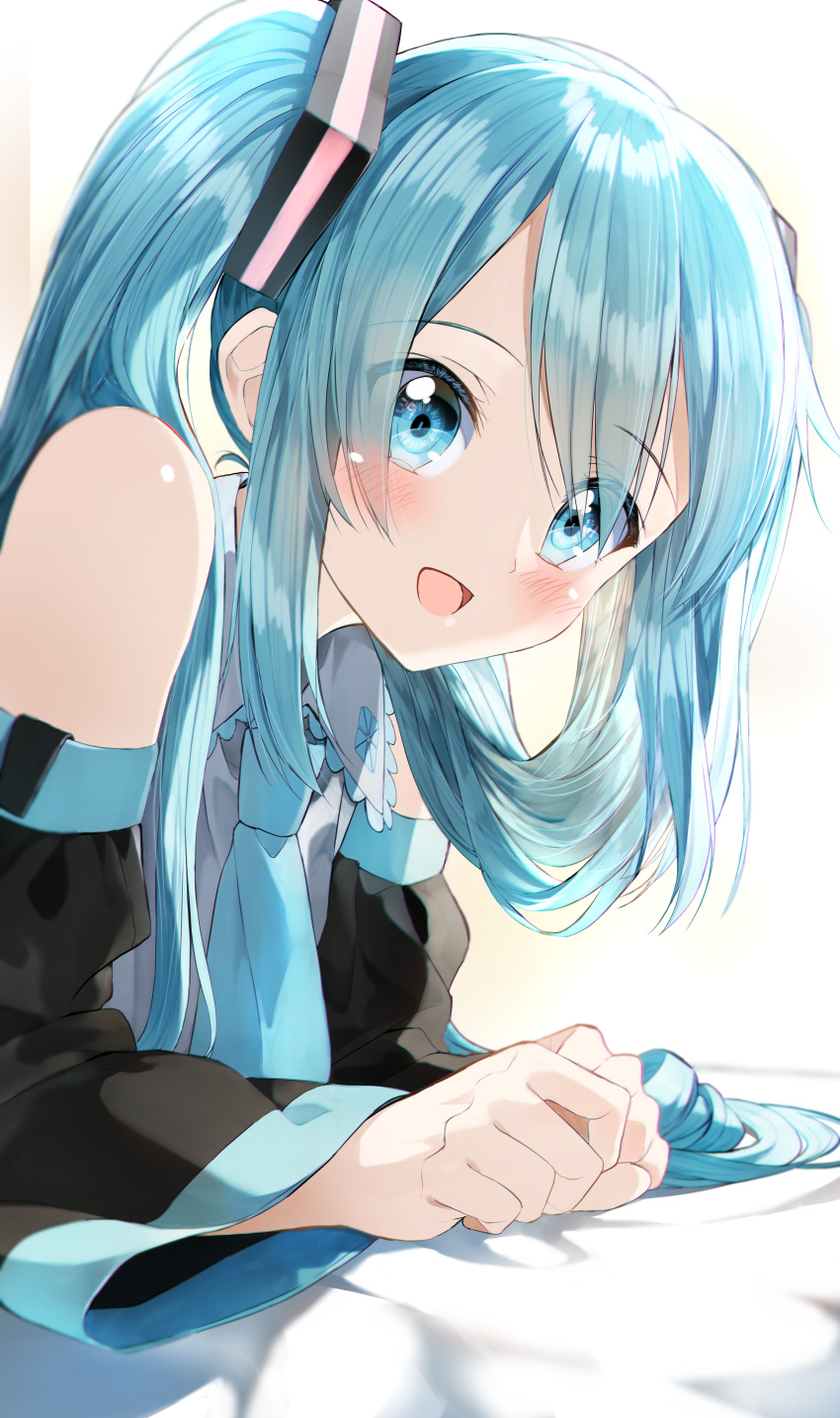 1girl :d absurdres bangs bare_shoulders bed_sheet black_sleeves blue_eyes blue_hair blue_neckwear blush collared_shirt commentary detached_sleeves eyebrows_visible_through_hair eyes_visible_through_hair grey_shirt hair_over_one_eye hatsune_miku highres long_hair long_sleeves looking_at_viewer necktie open_mouth pentagon_(railgun_ky1206) shirt sleeveless sleeveless_shirt smile solo twintails upper_body vocaloid wide_sleeves