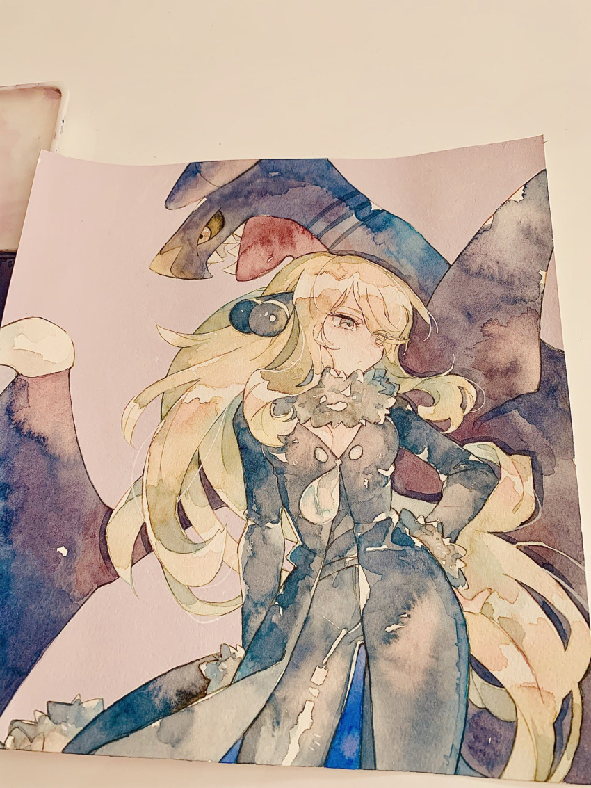 1girl bangs black_coat black_pants blonde_hair closed_mouth coat commentary_request cynthia_(pokemon) eyelashes floating_hair fur-trimmed_coat fur_collar fur_trim garchomp gen_4_pokemon grey_eyes hair_ornament hand_on_hip highres long_hair long_sleeves looking_to_the_side pants photo_(medium) pokemon pokemon_(creature) pokemon_(game) pokemon_dppt rrrpct shiny shiny_hair traditional_media watercolor_(medium)