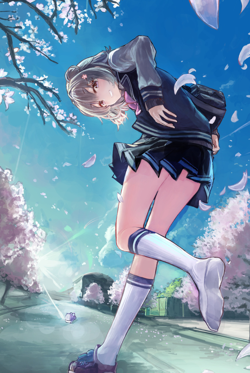 1girl absurdres ascot bag bent_over blazer blue_jacket blue_skirt cevio cherry_blossoms commentary falling_petals flower from_behind from_below grey_hair grin hair_bun hair_flower hair_ornament hairclip highres jacket kneehighs koharu_rikka looking_at_viewer looking_back microa miniskirt outdoors petals pink_flower pink_neckwear pleated_skirt road school_uniform shoe_loss shoe_removed shoes short_hair shoulder_bag single_shoe skirt smile sneakers solo street sunrise synthesizer_v tree violet_eyes walking white_legwear