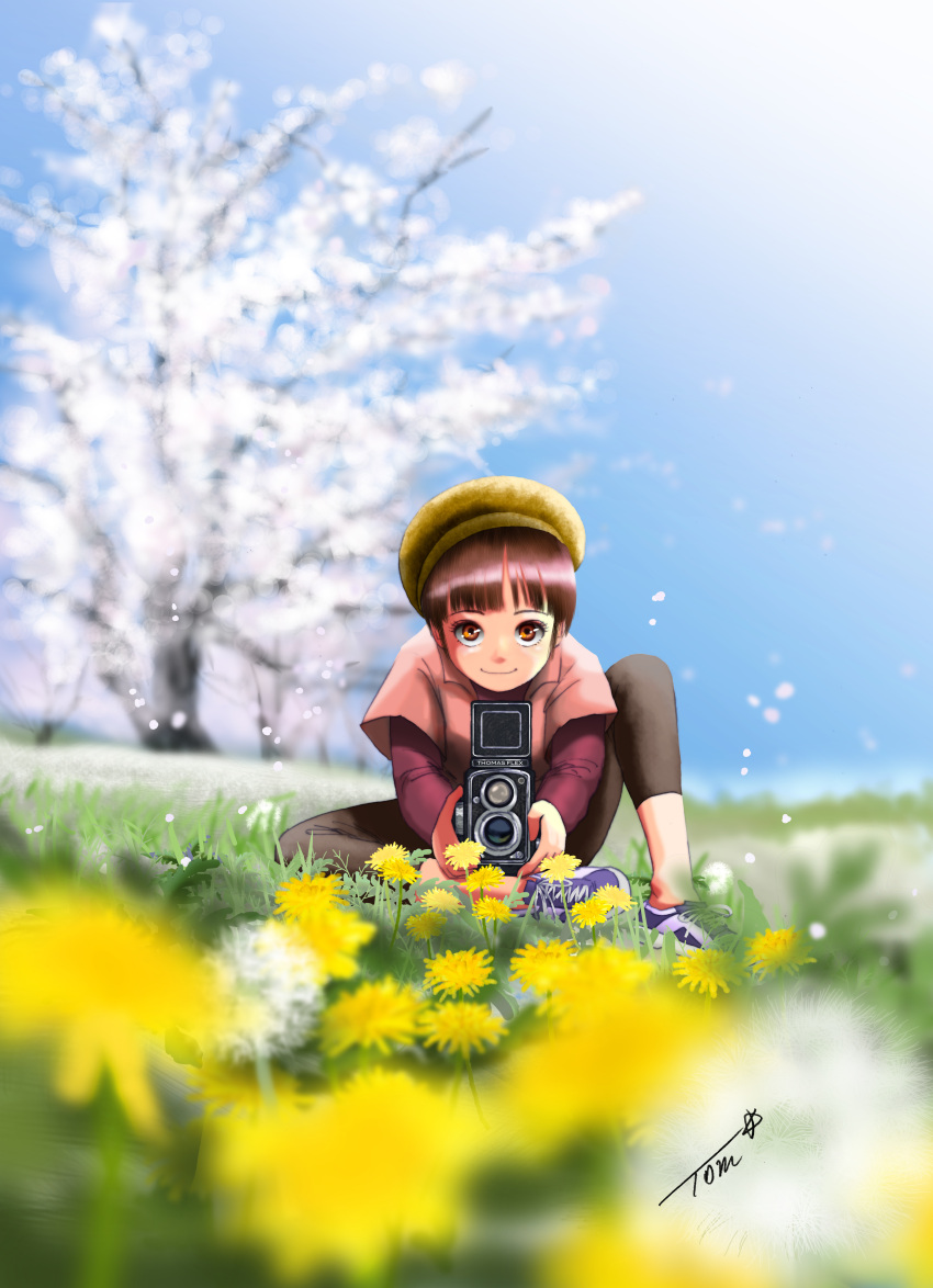 1girl absurdres bangs blue_sky blurry blurry_background blurry_foreground brown_eyes brown_pants camera chutohampa dandelion depth_of_field flower grass highres long_sleeves looking_at_viewer original outdoors pants pink_shirt plant purple_footwear shirt short_over_long_sleeves short_sleeves sky smile solo yellow_flower yellow_headwear