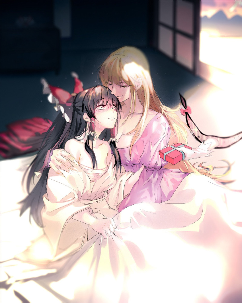 2girls alternate_costume arm_ribbon bangs bare_shoulders blonde_hair blurry blurry_background blush bow box breasts brown_hair closed_eyes closed_mouth collarbone commentary_request day dress eyebrows_visible_through_hair facing_another frilled_bow frilled_hair_tubes frills fusuma futon gap_(touhou) gift gift_box gloves hair_between_eyes hair_bow hair_tubes hakurei_reimu hand_on_another's_arm head_to_head highres holding holding_blanket holding_gift indoors japanese_clothes juban light_particles light_rays long_hair long_sleeves looking_at_another medium_breasts multiple_girls off_shoulder on_bed open_door purple_dress red_bow ribbon sarashi sidelocks sitting sleepwear sliding_doors small_breasts sunlight sweatdrop touhou valentine white_gloves wide_sleeves wyxg yakumo_yukari yuri