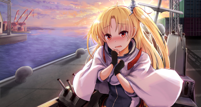 1girl azur_lane bangs black_gloves blonde_hair blush capelet cleveland_(azur_lane) clouds cloudy_sky commentary_request dock embarrassed eyebrows_visible_through_hair eyes_visible_through_hair fingerless_gloves gloves horizon long_hair looking_at_viewer machinery one_side_up red_eyes sidelocks sky solo sunrise takeyaman turret twilight