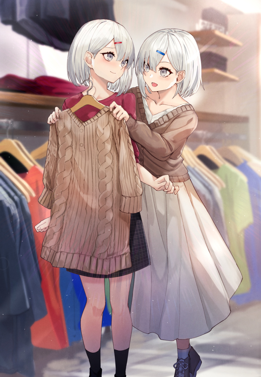 2girls :d aran_sweater bangs black_footwear black_legwear black_skirt brown_jacket brown_sweater closed_mouth clothes_hanger collarbone commentary_request dress eisuto eye_contact feet_out_of_frame grey_eyes grey_hair hair_between_eyes hair_ornament hairclip highres holding holding_clothes indoors jacket looking_at_another looking_back multiple_girls open_mouth original red_shirt ribbed_sweater shirt shoes short_hair skirt smile socks standing sweater white_dress white_legwear