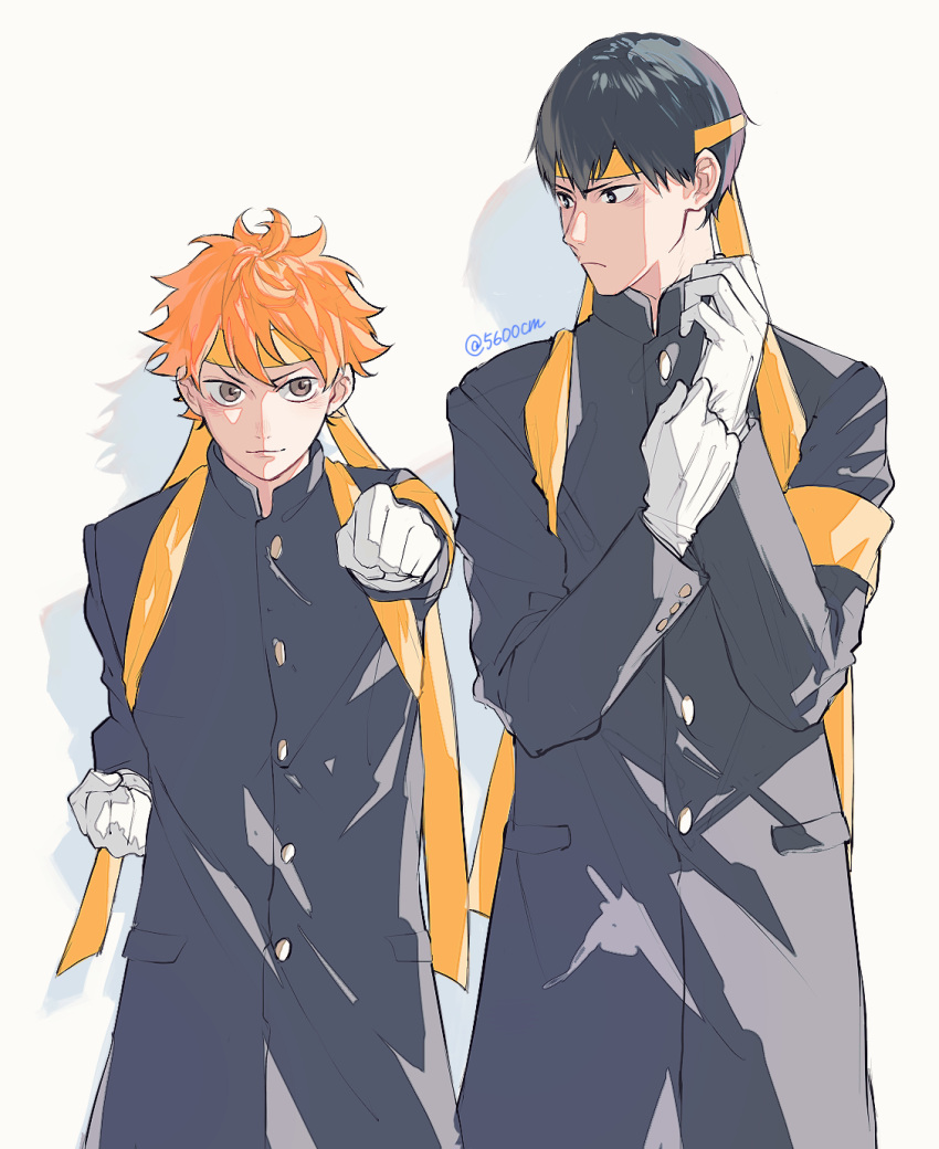 2boys 5600cm armband bangs black_hair buttons clenched_hand gloves haikyuu!! highres hinata_shouyou kageyama_tobio looking_at_viewer looking_away male_focus multiple_boys orange_hair simple_background standing twintails white_gloves