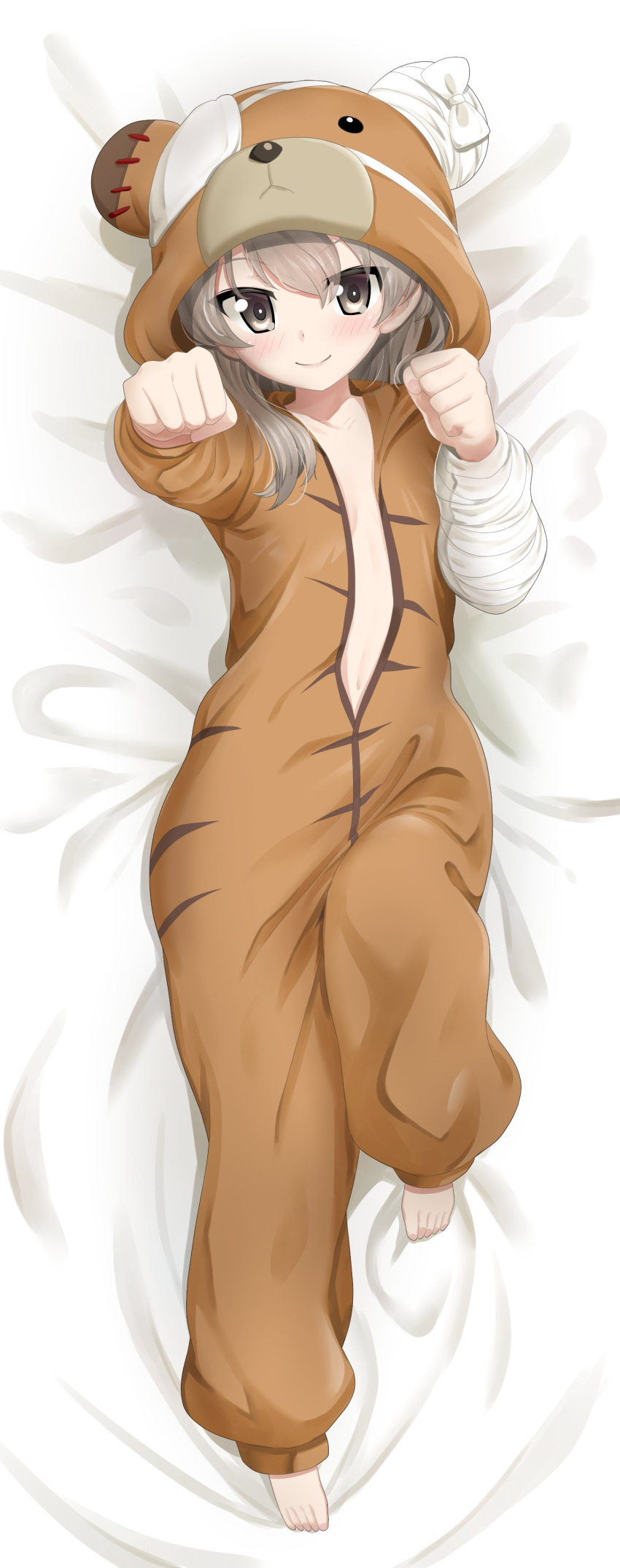 1girl absurdres animal_costume animal_hood bandages bangs barefoot bear_costume bear_hood bed_sheet boko_(girls_und_panzer) boko_(girls_und_panzer)_(cosplay) brown_eyes clenched_hands closed_mouth commentary cosplay dakimakura_(object) excel_(shena) eyepatch from_above girls_und_panzer highres hood hood_up knee_up light_brown_hair long_hair long_sleeves looking_at_viewer lying on_back on_bed onesie partially_unzipped pillow shimada_arisu smile solo