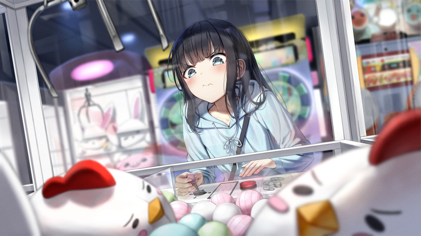 1girl 3: arcade arcade_cabinet ball bangs black_hair blue_eyes blue_hoodie blurry blurry_background blurry_foreground blush coin commentary_request crane_game depth_of_field eyebrows_visible_through_hair highres hood hoodie indoors long_hair long_sleeves original sidelocks solo stuffed_animal stuffed_chicken stuffed_toy superpig v-shaped_eyebrows