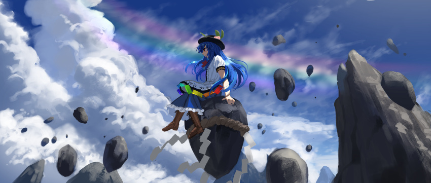 1girl bangs black_headwear blue_hair blue_skirt blue_sky boots bow bowtie brown_footwear closed_mouth clouds commentary cross-laced_footwear floating_rock food frills fruit full_body hat highres hinanawi_tenshi leaf long_hair looking_to_the_side outdoors peach puffy_short_sleeves puffy_sleeves rainbow rainbow_gradient rainbow_order red_bow red_eyes rock shirt short_sleeves skirt sky solo standing suna_(s73d) touhou white_shirt