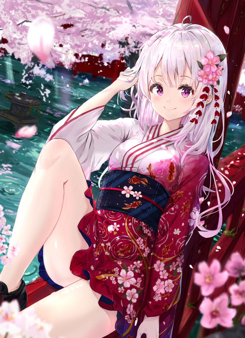 1girl absurdres ahoge animal_print arm_up bangs bare_legs black_footwear blue_sash blush cherry_blossoms commentary fish_print floral_print flower hand_in_hair highres japanese_clothes kimono knee_up long_hair long_sleeves looking_at_viewer na_kyo obi original petals pink_eyes pink_flower pink_hair print_kimono print_sash sash shoes sitting smile solo symbol_commentary