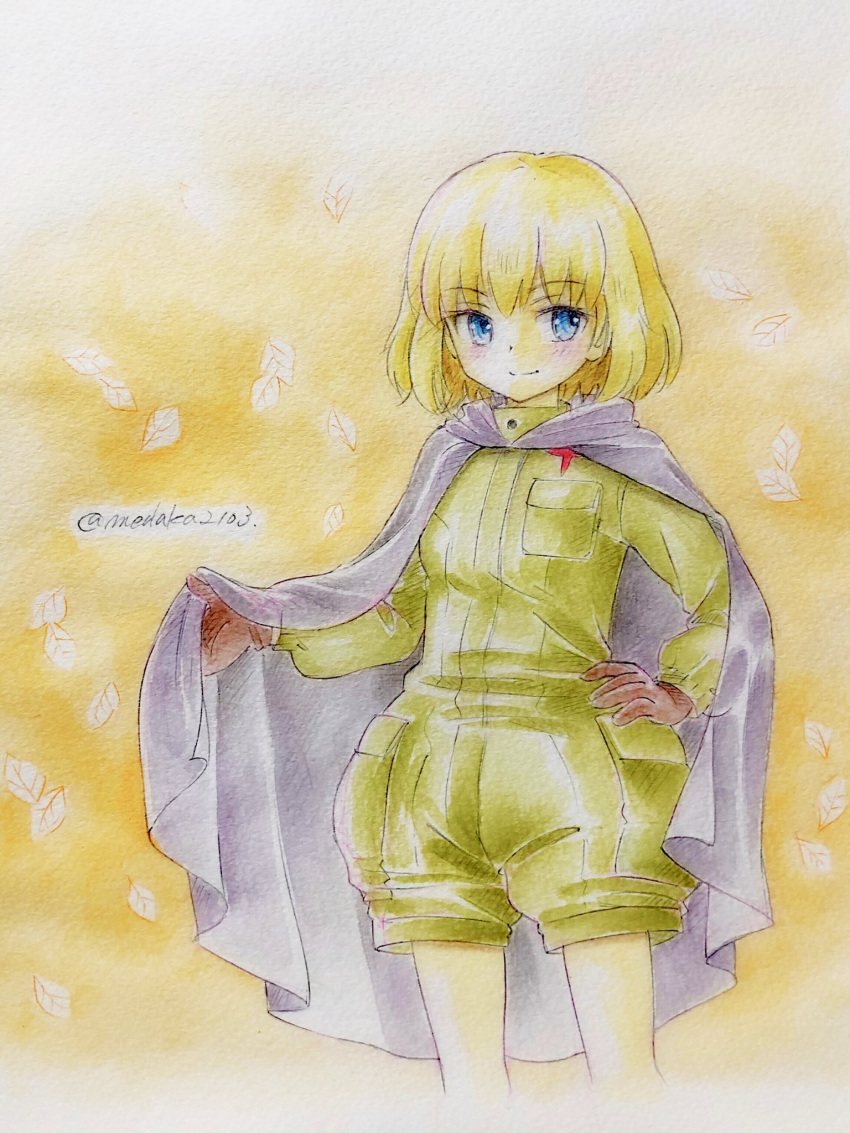 1girl bangs black_cape black_gloves blonde_hair blue_eyes bob_cut cape closed_mouth colored_pencil_(medium) commentary cowboy_shot cropped_legs eyebrows_visible_through_hair girls_und_panzer gloves green_jumpsuit hand_on_hip highres insignia jumpsuit katyusha_(girls_und_panzer) leaf long_sleeves looking_at_viewer orange_background pravda_military_uniform q-bee_(aaru) short_hair short_jumpsuit smile solo standing texture traditional_media twitter_username