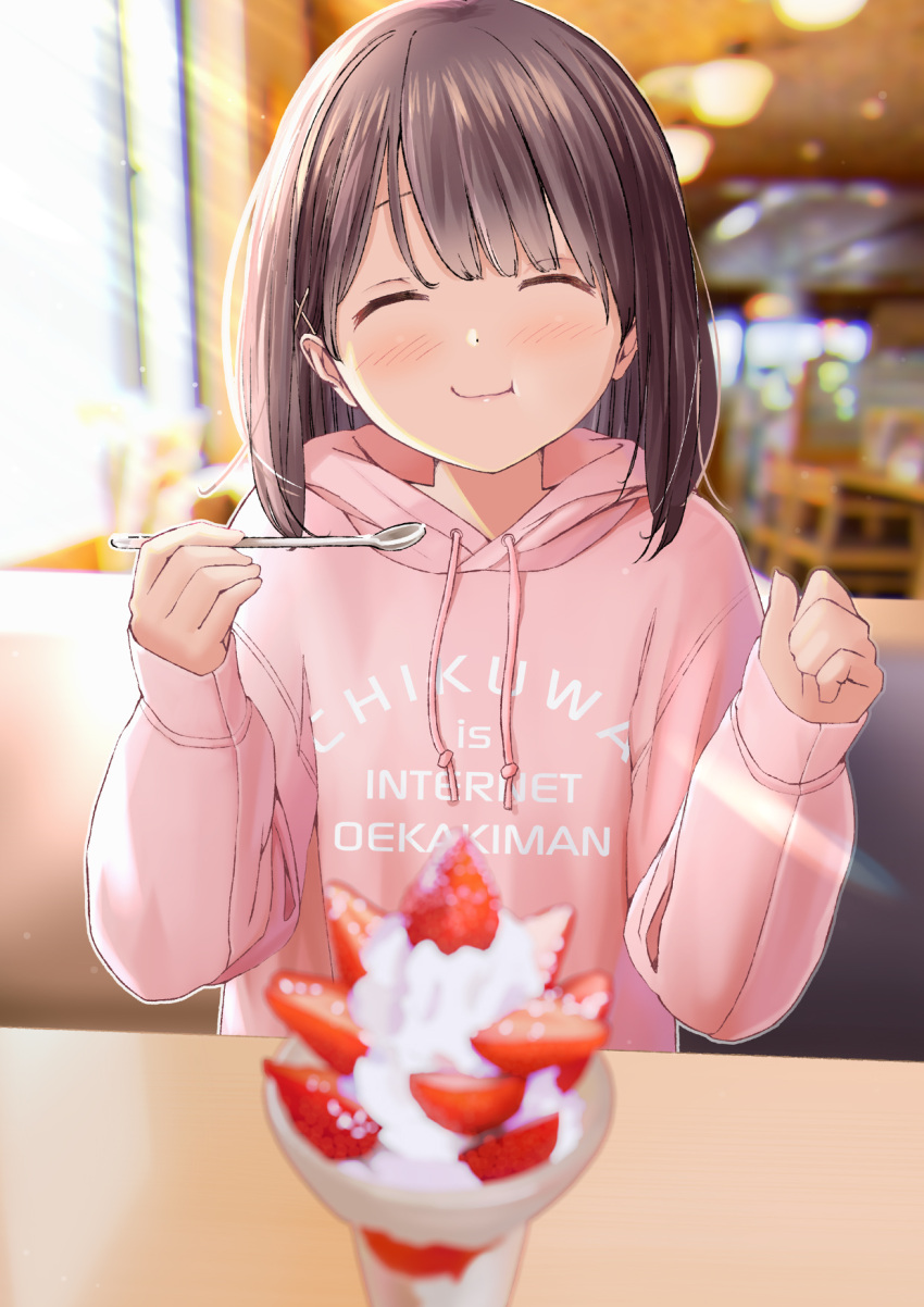1girl ^_^ blurry blurry_background blush brown_hair chikuwa_(odennabe) closed_eyes closed_mouth clothes_writing commentary_request cream eating food fruit hair_ornament highres holding holding_spoon indoors jacket long_sleeves original pink_jacket pov_across_table short_hair sitting solo spoon strawberry x_hair_ornament
