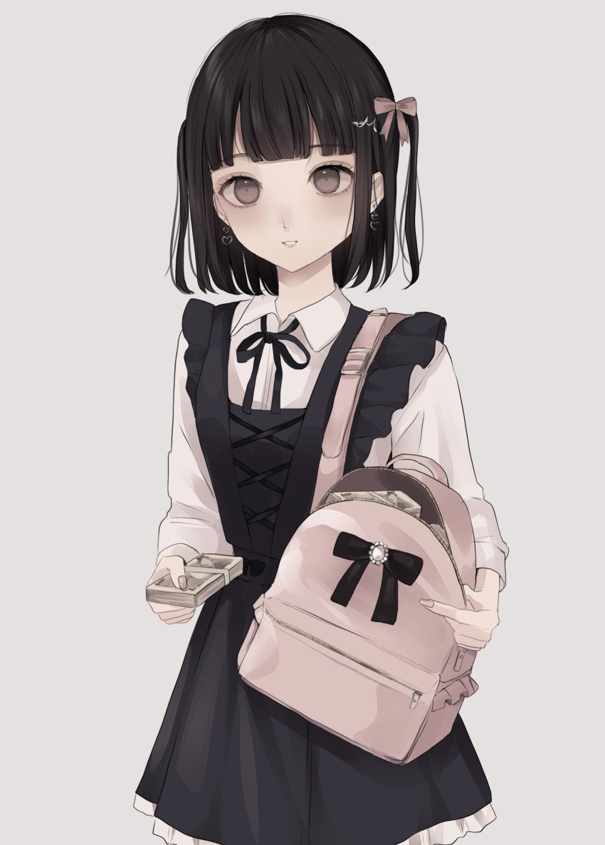 1girl backpack bag bangs black_dress black_hair black_ribbon bow brown_bow brown_eyes collared_shirt commentary_request dress dress_shirt earrings eyebrows_visible_through_hair frilled_dress frills grey_background hair_bow hair_ornament heart heart_earrings highres holding holding_bag holding_money jewelry long_sleeves looking_at_viewer money neck_ribbon original parted_lips ribbon shirt simple_background sleeveless sleeveless_dress smile solo tsuruse two_side_up white_shirt