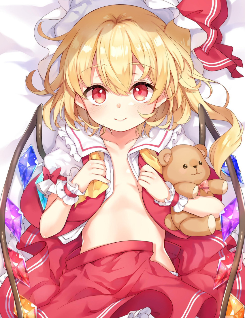 1girl bangs blonde_hair blush closed_mouth collarbone cowboy_shot crystal eyebrows_visible_through_hair flandre_scarlet flat_chest hat highres holding holding_stuffed_toy looking_at_viewer mob_cap one_side_up open_clothes open_shirt paragasu_(parags112) petticoat red_eyes red_skirt red_vest short_hair skirt smile solo stuffed_animal stuffed_toy teddy_bear touhou vest wings wrist_cuffs