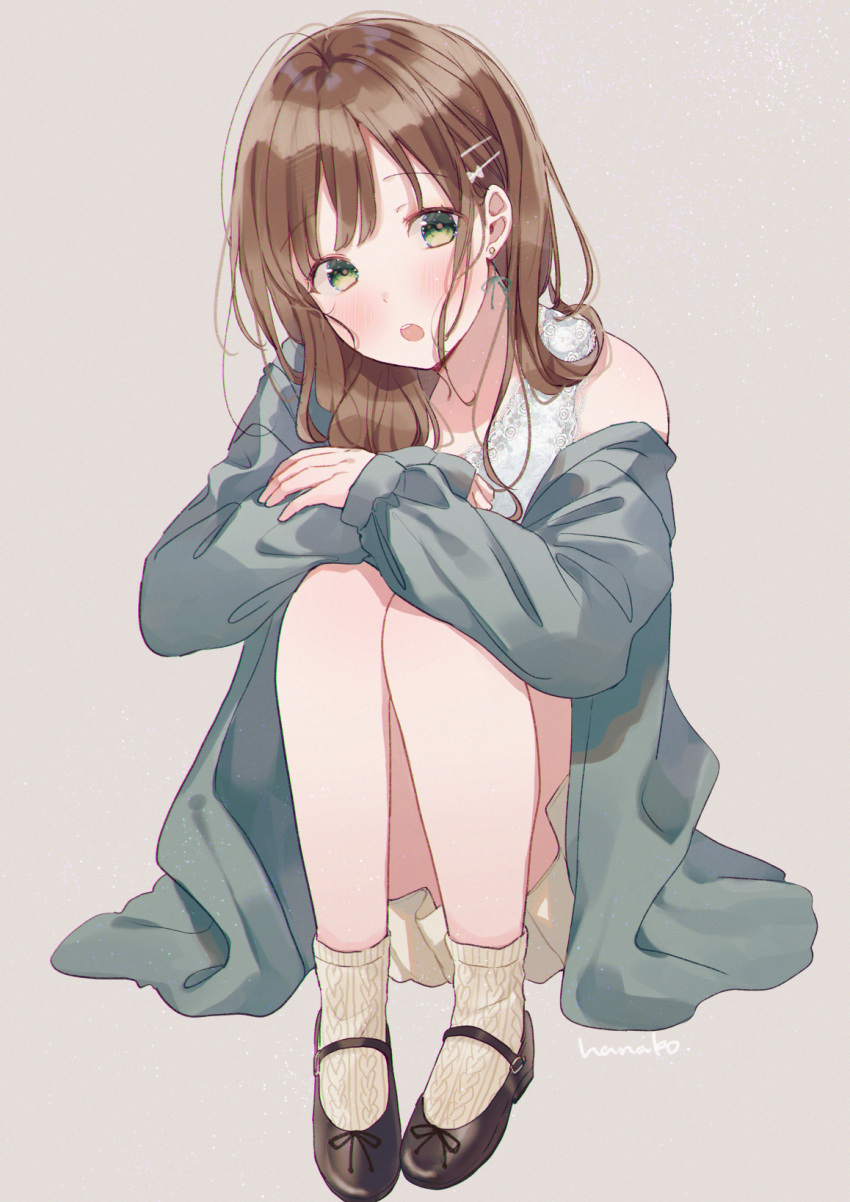 1girl beige_background blush brown_footwear brown_hair camisole cardigan commentary earrings green_cardigan green_eyes hair_ornament hairclip hanako151 highres jewelry knees_up legs_together long_hair long_sleeves open_mouth original pleated_skirt shoes signature simple_background sitting skirt socks solo symbol_commentary white_camisole yellow_legwear yellow_skirt